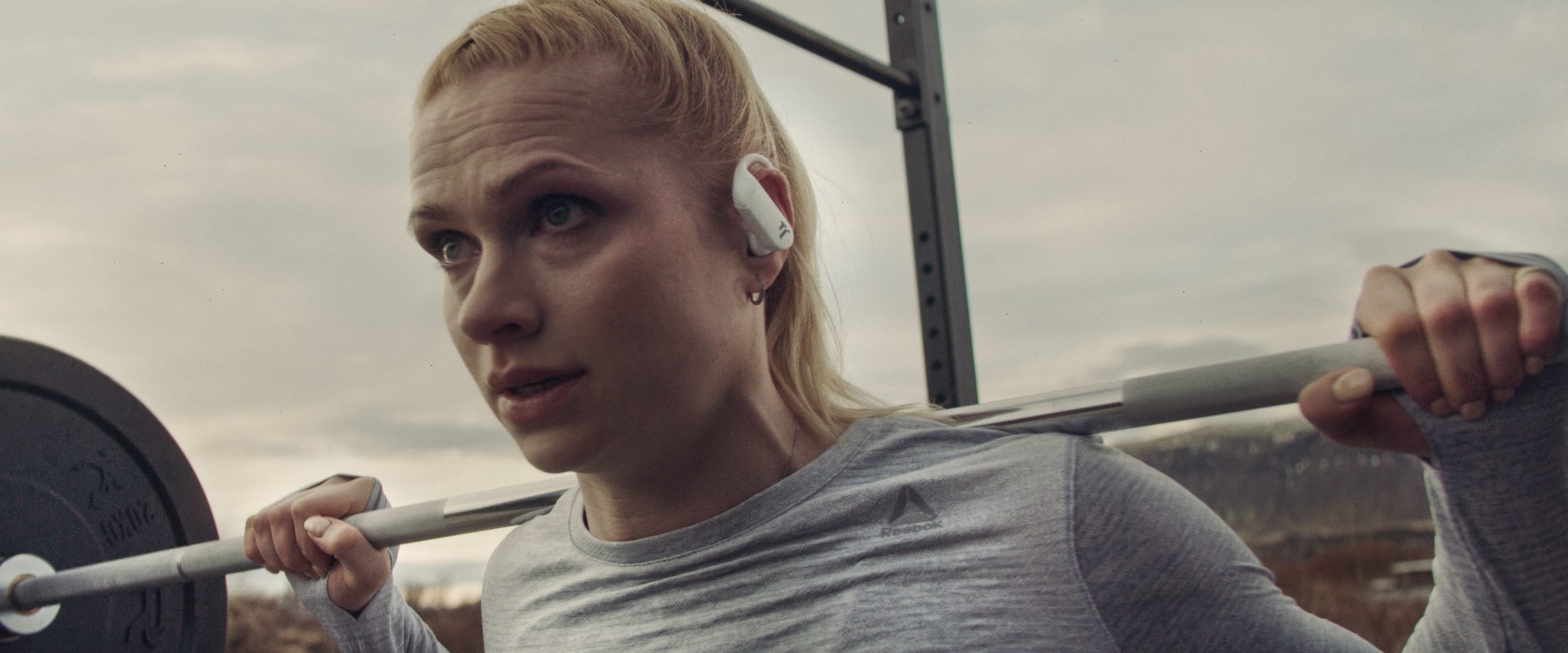 Girl working out with Dottir In-Ear Headphones