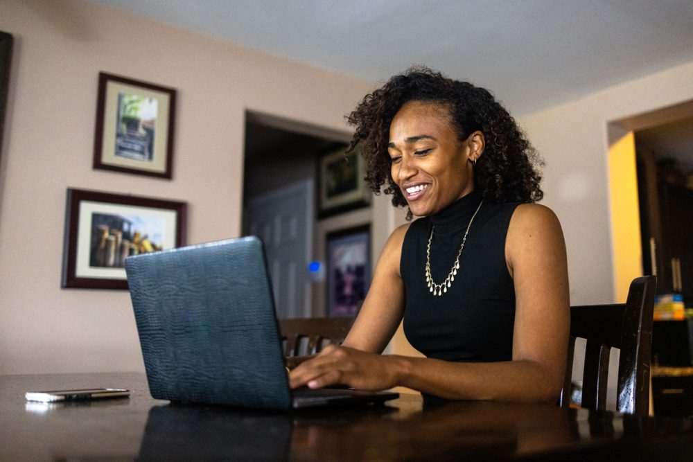 a woman working on a Microsoft laptop using Windows 11